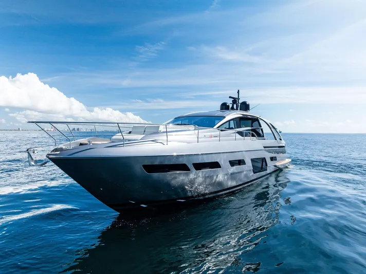 Barnext Yacht Photos Pics Luxurious 2025 Pershing 7X yacht cruising on open sea under clear blue sky.