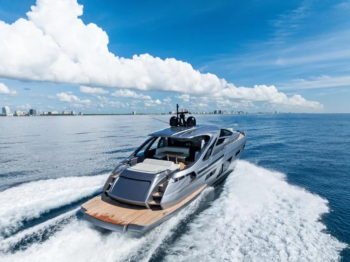 Barnext Yacht Photos Pics Luxury Pershing 7X yacht cruising on open sea under clear blue sky, 2025 model.
