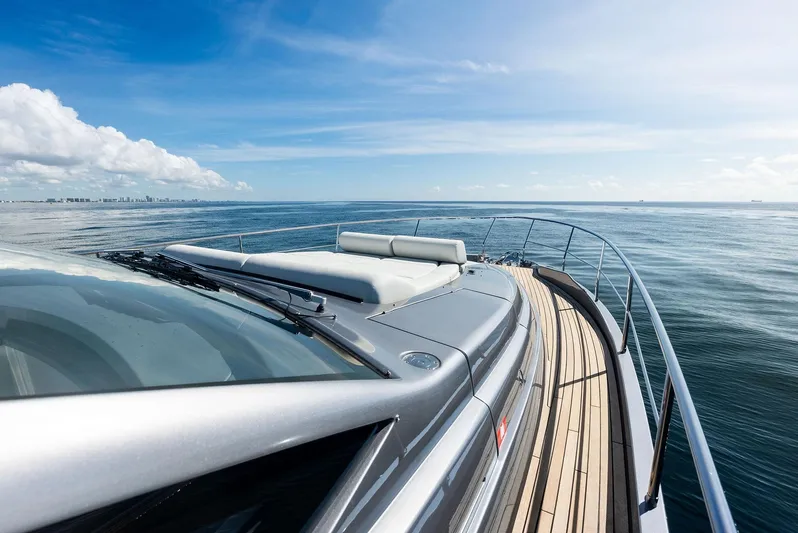 Barnext Yacht Photos Pics 2025 Pershing 7X yacht cruising on open sea under clear blue sky.