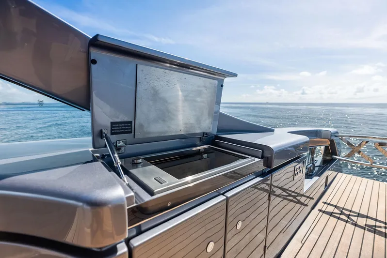 Barnext Yacht Photos Pics Open grill on Pershing 7X yacht, 2025 model, with ocean view in the background.