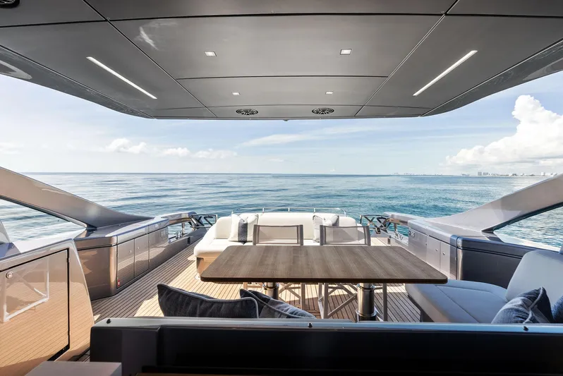 Barnext Yacht Photos Pics Luxurious 2025 Pershing 7X yacht interior with ocean view, featuring elegant seating and modern design.