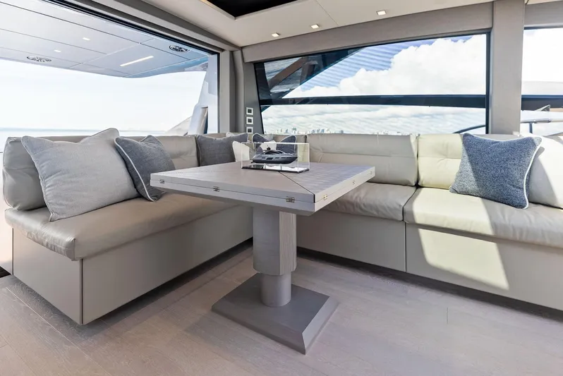 Barnext Yacht Photos Pics Luxurious interior of 2025 Pershing 7X yacht with modern seating and table.