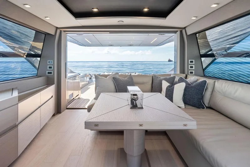 Barnext Yacht Photos Pics Luxurious interior of 2025 Pershing 7X yacht with ocean view and modern seating area.