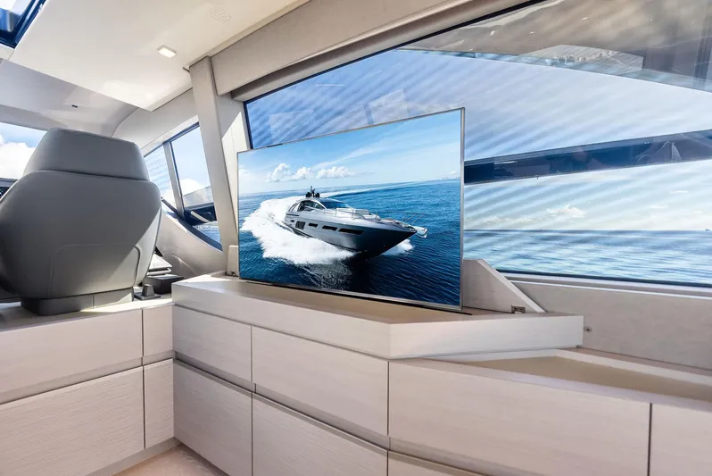 Barnext Yacht Photos Pics Luxurious interior of 2025 Pershing 7X yacht with sleek design and ocean view.