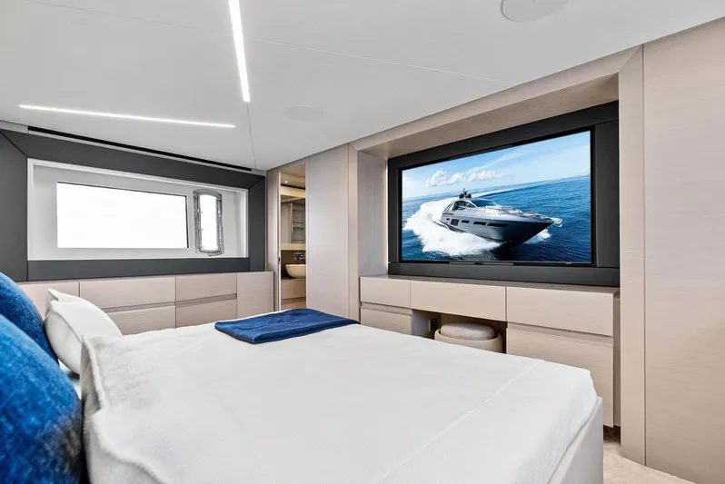 Barnext Yacht Photos Pics Luxurious bedroom interior of 2025 Pershing 7X yacht with large TV and modern design.