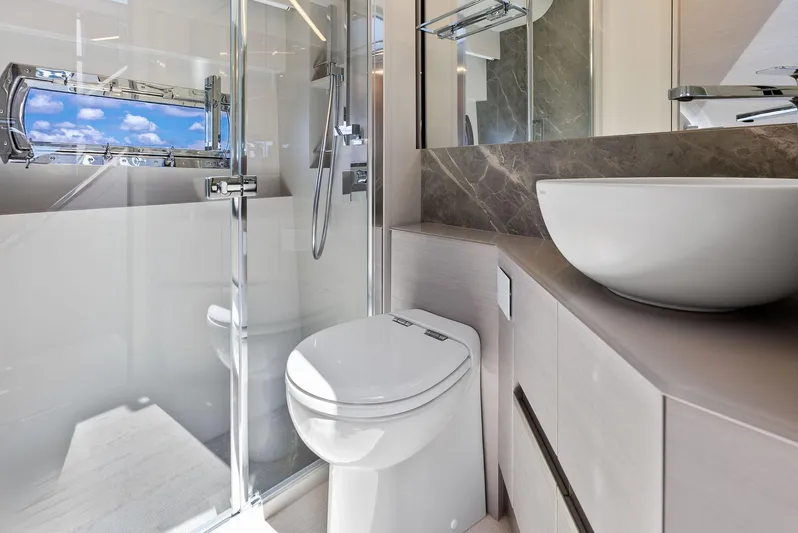 Barnext Yacht Photos Pics Luxurious bathroom in 2025 Pershing 7X yacht with modern fixtures and ocean view.