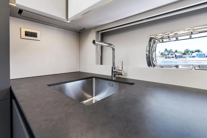 Barnext Yacht Photos Pics Modern kitchen sink in 2025 Pershing 7X yacht, featuring sleek design and ocean view.