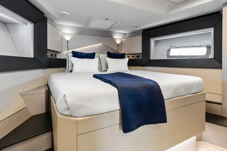 Barnext Yacht Photos Pics Luxurious bedroom interior of 2025 Pershing 7X yacht with modern design and elegant bedding.