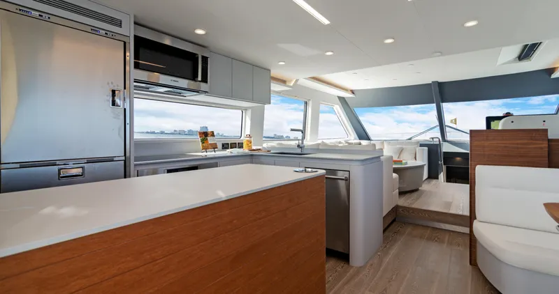 Clb65 Yacht Photos Pics Luxurious interior of 2024 CL Yachts CLB65, featuring modern kitchen and panoramic windows.