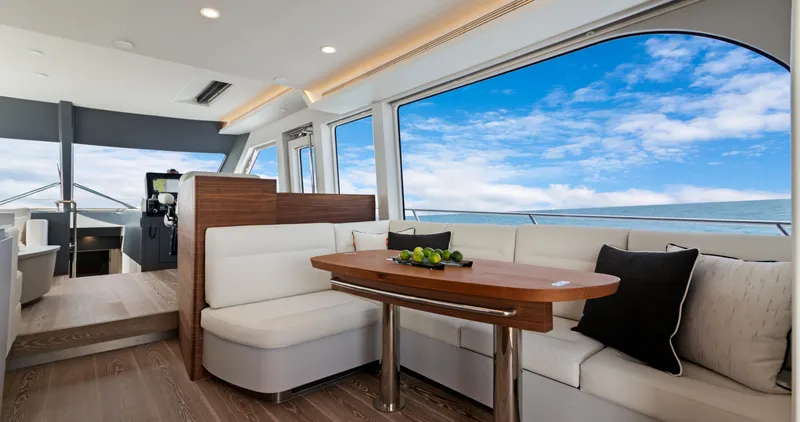 Clb65 Yacht Photos Pics Luxurious interior of 2024 CL Yachts CLB65 with ocean view and elegant seating.