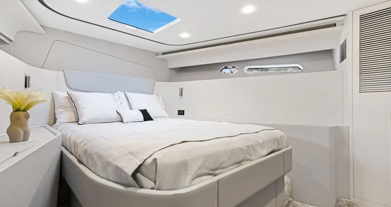 Clb65 Yacht Photos Pics Luxurious bedroom interior of 2024 CL Yachts CLB65 with modern design and skylight.