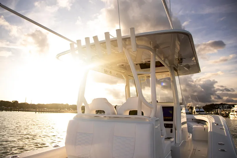 New Stock Yacht Photos Pics 2026 Yellowfin 36 Offshore boat at sunset on the water.