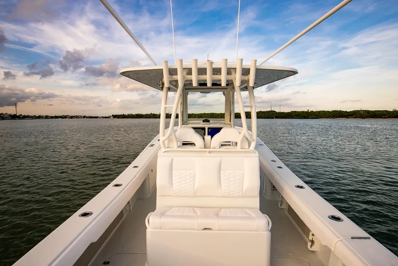 New Stock Yacht Photos Pics 2026 Yellowfin 36 Offshore boat on calm water under a blue sky.