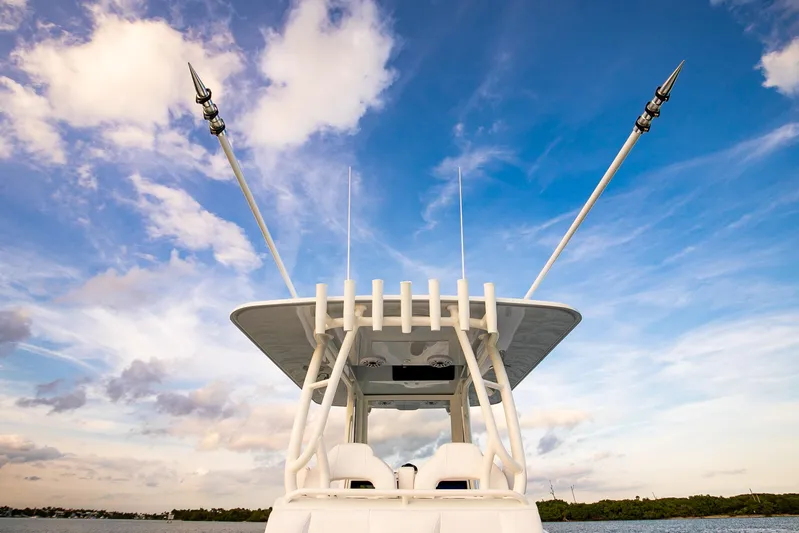 New Stock Yacht Photos Pics 2026 Yellowfin 36 Offshore boat against a vibrant blue sky.