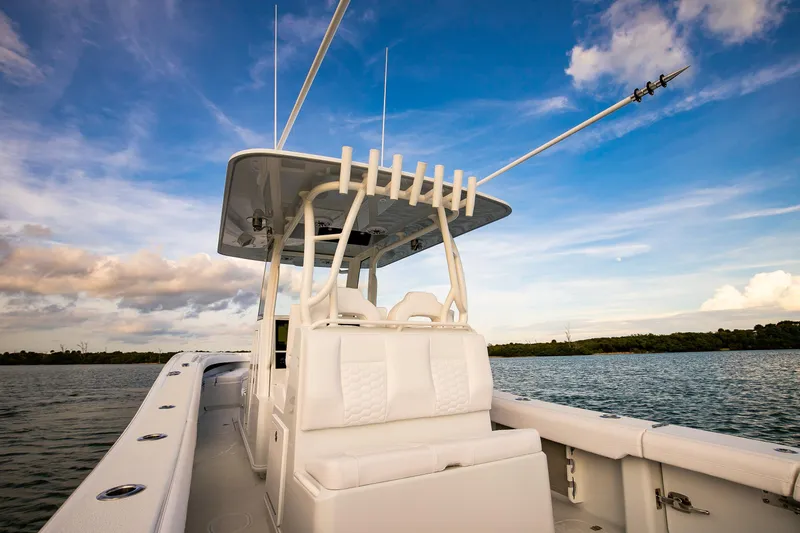 New Stock Yacht Photos Pics 2026 Yellowfin 36 Offshore boat on calm water under a blue sky.