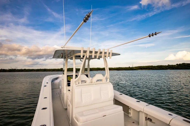 New Stock Yacht Photos Pics 2026 Yellowfin 36 Offshore boat on calm water under a blue sky.