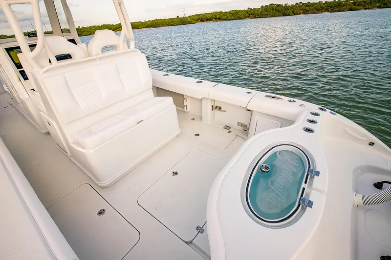 New Stock Yacht Photos Pics 2026 Yellowfin 36 Offshore boat interior with white seating and fishing amenities.
