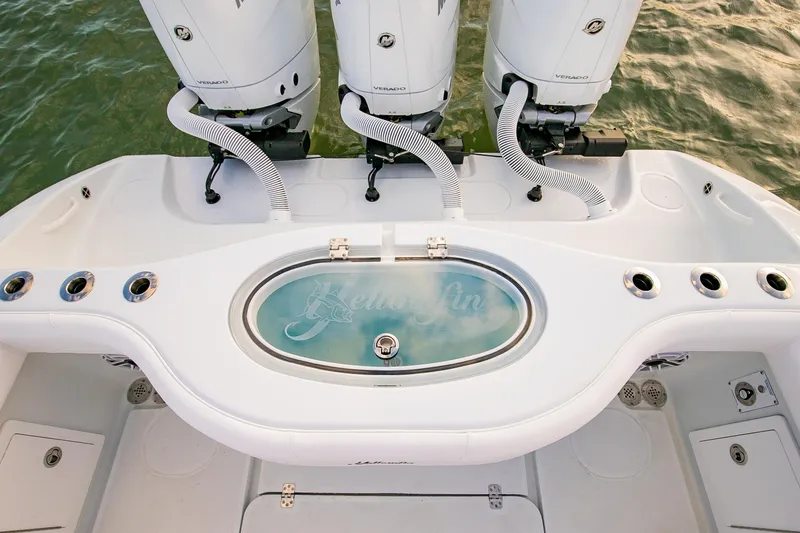 New Stock Yacht Photos Pics 2026 Yellowfin 36 Offshore boat with triple engines and livewell on deck.