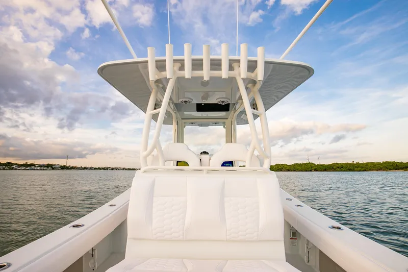 New Stock Yacht Photos Pics 2026 Yellowfin 36 Offshore boat on calm water under a blue sky.