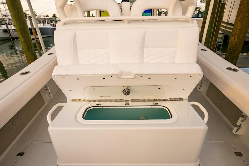 New Stock Yacht Photos Pics 2026 Yellowfin 36 Offshore boat with open storage compartment, white seating.