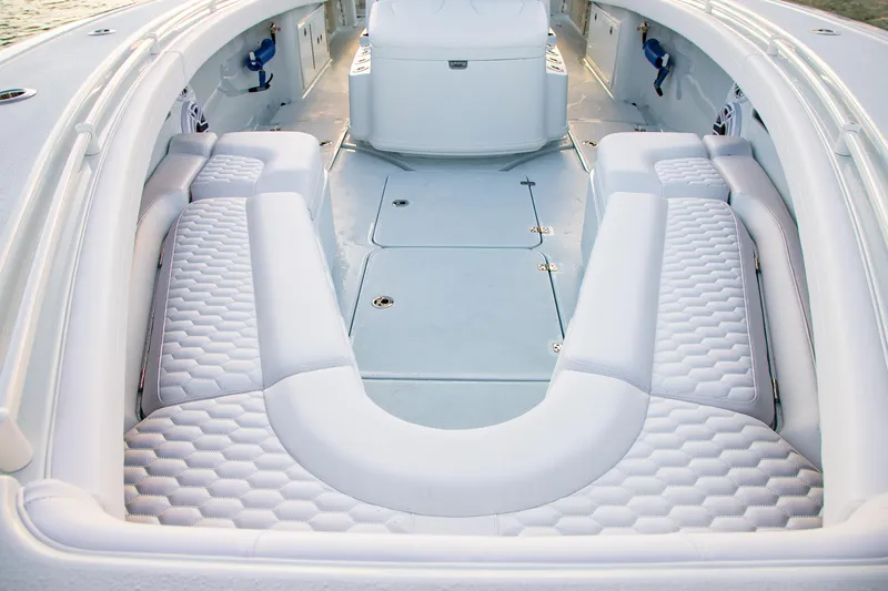 New Stock Yacht Photos Pics 2026 Yellowfin 36 Offshore boat interior with luxurious white seating and spacious deck.