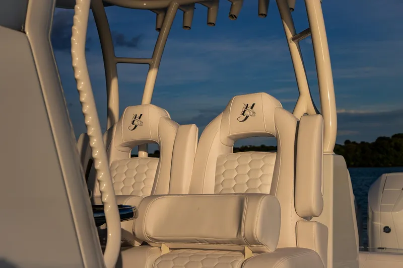 New Stock Yacht Photos Pics 2026 Yellowfin 36 Offshore boat with luxurious white seating and rod holders.