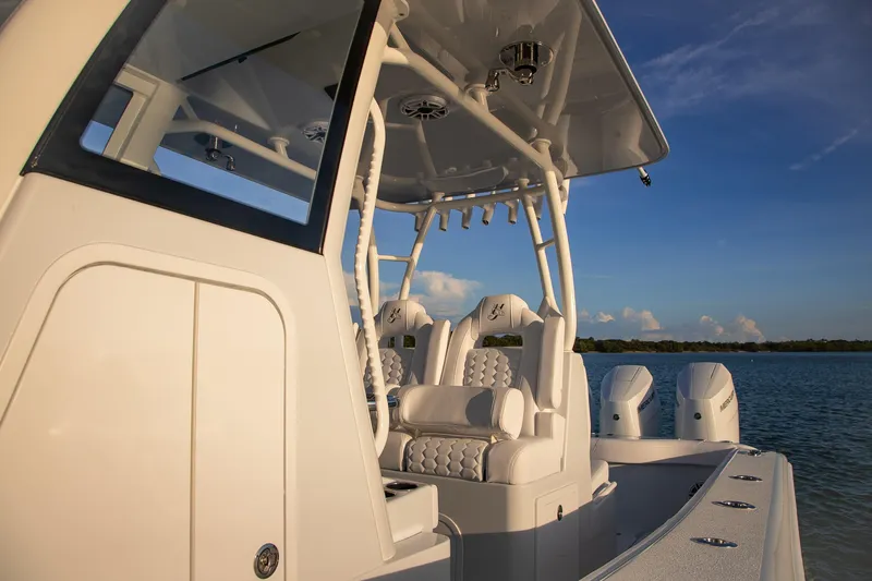 New Stock Yacht Photos Pics 2026 Yellowfin 36 Offshore boat with sleek design and powerful engines on calm water.