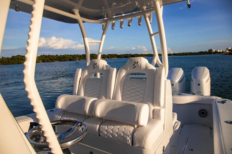 New Stock Yacht Photos Pics 2026 Yellowfin 36 Offshore boat interior with luxurious seating and ocean backdrop.