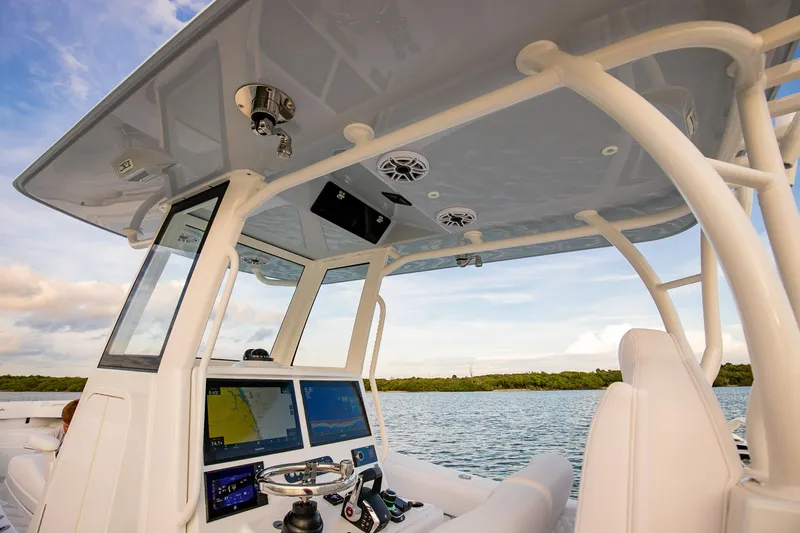 New Stock Yacht Photos Pics 2026 Yellowfin 36 Offshore boat cockpit with advanced navigation system and ocean view.