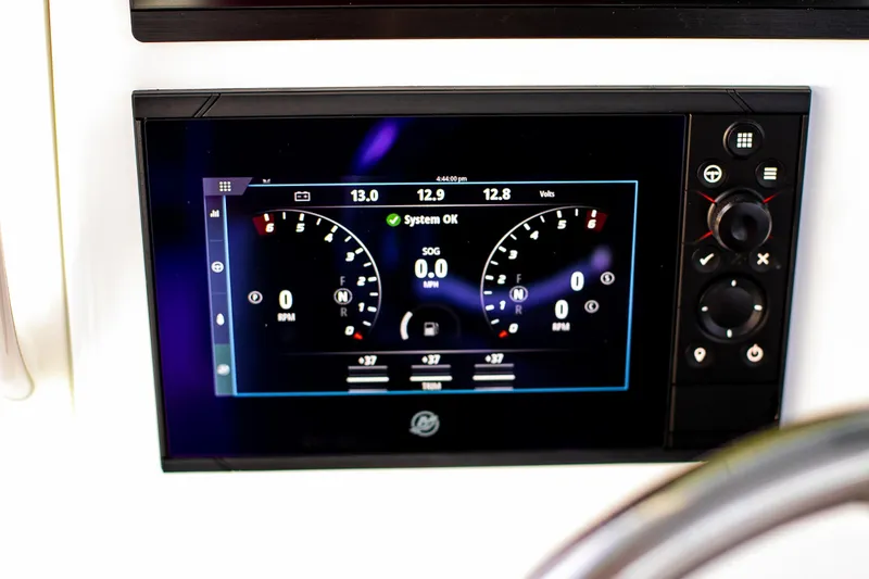 New Stock Yacht Photos Pics 2026 Yellowfin 36 Offshore boat dashboard with digital display and controls.