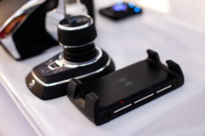 New Stock Yacht Photos Pics Control panel of 2026 Yellowfin 36 Offshore boat with joystick and wireless charger.