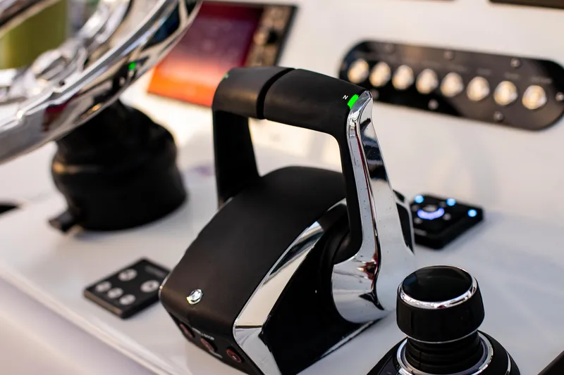 New Stock Yacht Photos Pics Control panel of 2026 Yellowfin 36 Offshore boat, featuring modern throttle and navigation controls.