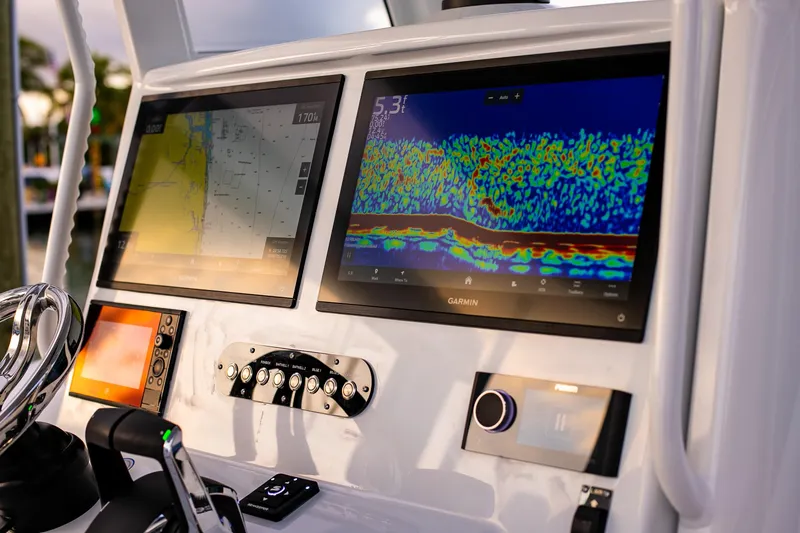 New Stock Yacht Photos Pics 2026 Yellowfin 36 Offshore boat dashboard with advanced Garmin navigation displays.