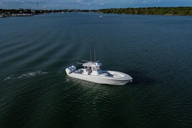 New Stock Yacht Photos Pics 2026 Yellowfin 36 Offshore boat cruising on calm waters under a clear sky.