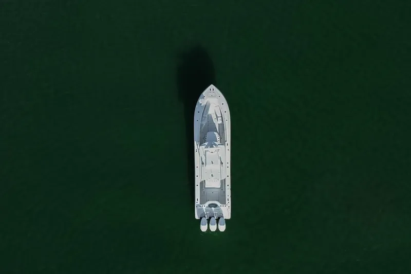 New Stock Yacht Photos Pics Aerial view of 2026 Yellowfin 36 Offshore boat on dark green water.