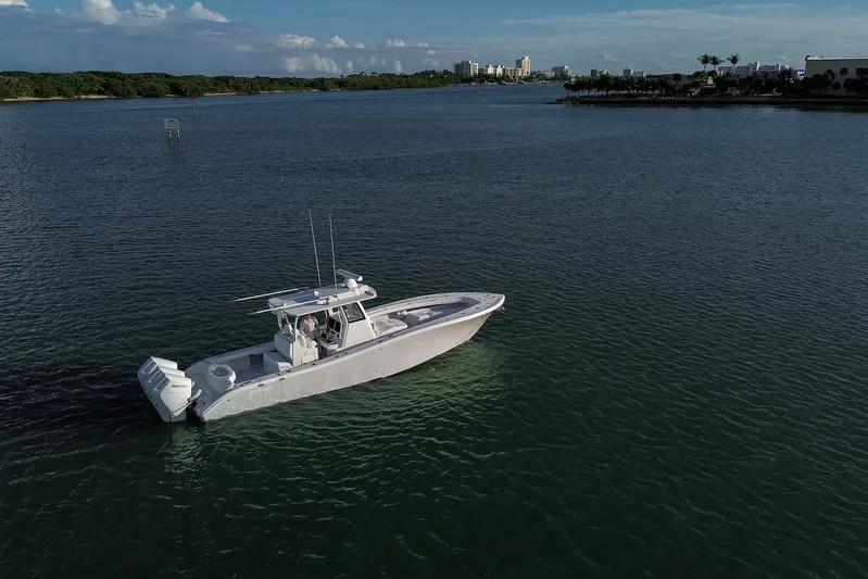 New Stock Yacht Photos Pics 2026 Yellowfin 36 Offshore boat cruising on calm waters under a clear sky.