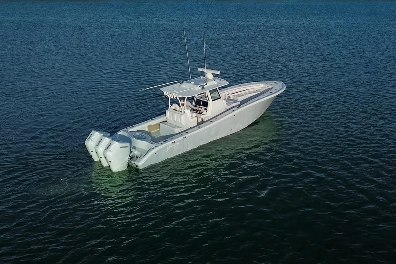 New Stock Yacht Photos Pics 2026 Yellowfin 36 Offshore boat on calm blue water.