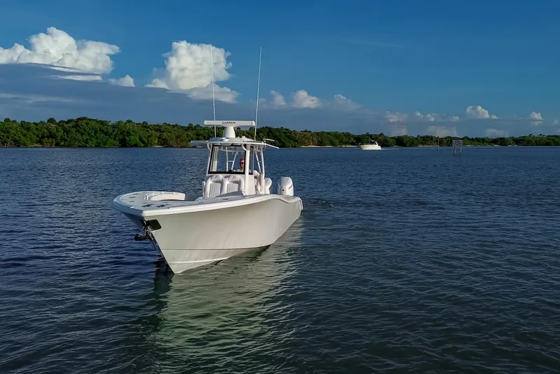 New Stock Yacht Photos Pics 2026 Yellowfin 36 Offshore boat cruising on calm waters under a clear blue sky.