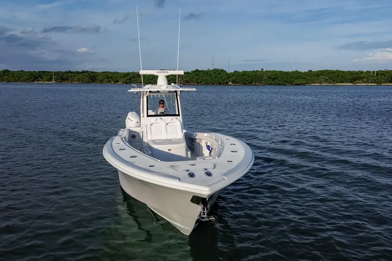 New Stock Yacht Photos Pics 2026 Yellowfin 36 Offshore boat on calm water, clear sky background.
