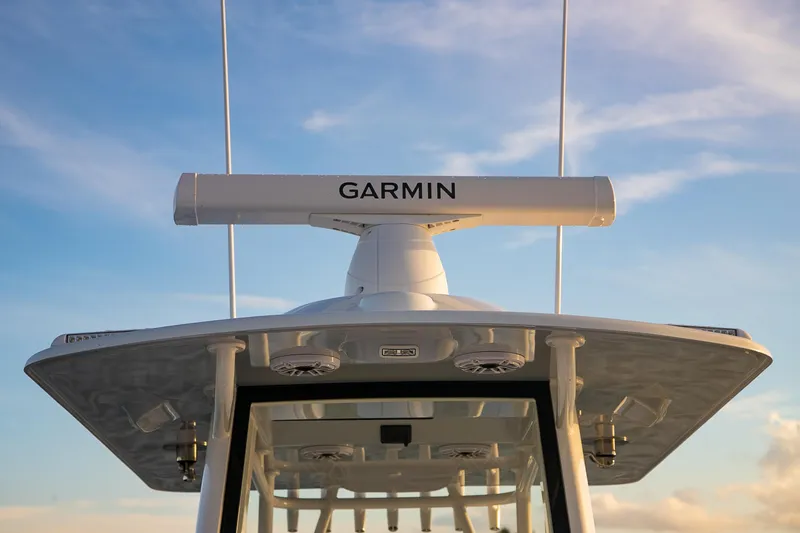 New Stock Yacht Photos Pics 2026 Yellowfin 36 Offshore boat with Garmin radar against blue sky.
