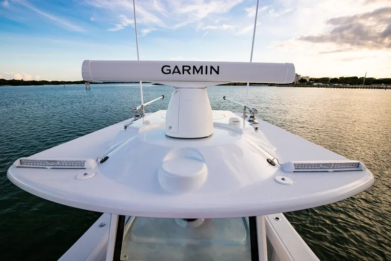 New Stock Yacht Photos Pics 2026 Yellowfin 36 Offshore boat with Garmin radar on calm water.