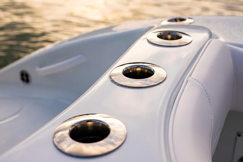 New Stock Yacht Photos Pics Close-up of 2026 Yellowfin 36 Offshore boat's rod holders at sunset.