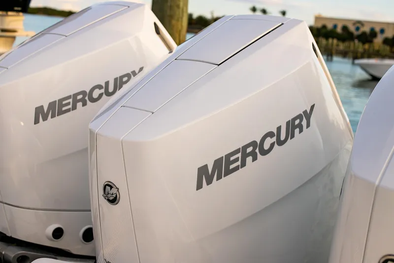 New Stock Yacht Photos Pics Twin Mercury outboard engines on a 2026 Yellowfin 36 Offshore boat, docked by the water.