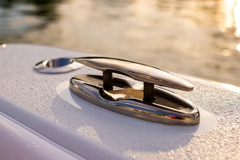 New Stock Yacht Photos Pics 2026 Yellowfin 36 Offshore boat cleat in sunlight, showcasing sleek design and craftsmanship.