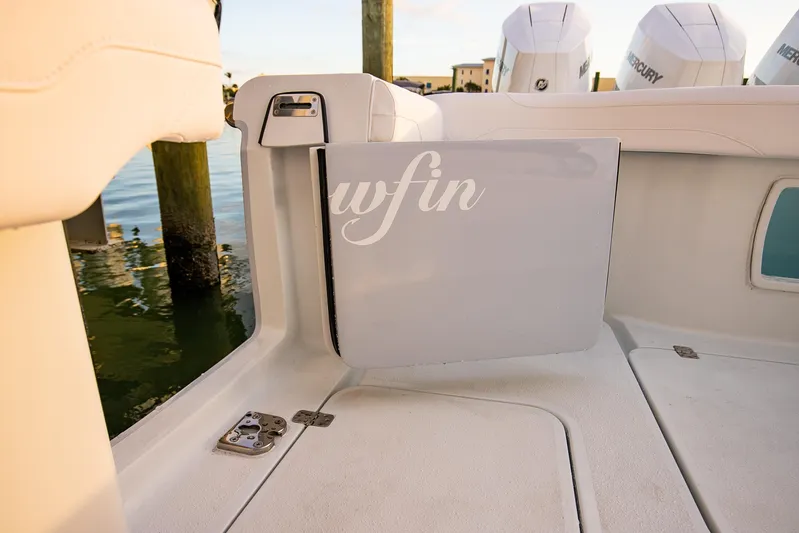 New Stock Yacht Photos Pics 2026 Yellowfin 36 Offshore boat interior with Mercury engines in background.