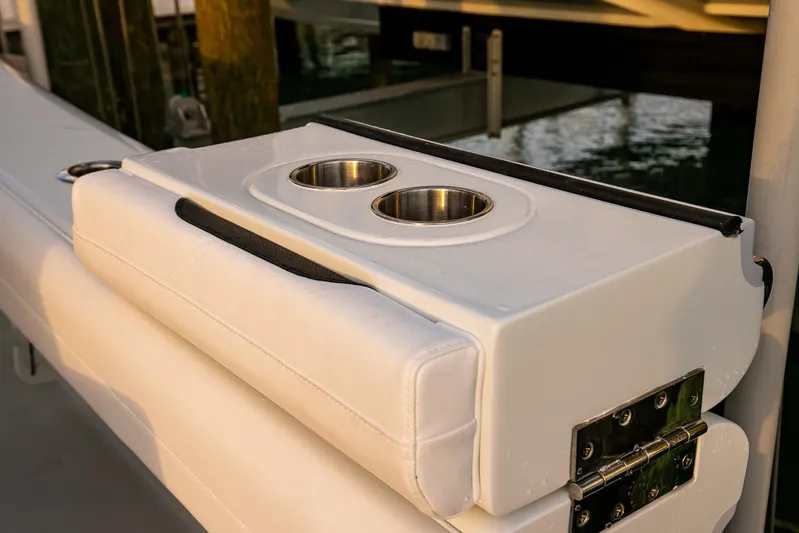 New Stock Yacht Photos Pics 2026 Yellowfin 36 Offshore boat with dual cup holders on white cushioned seat.