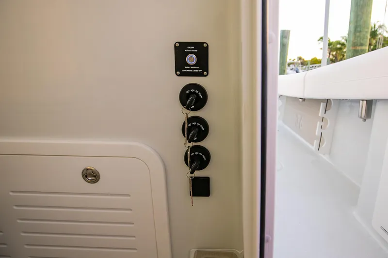 New Stock Yacht Photos Pics 2026 Yellowfin 36 Offshore boat control panel with ignition keys and switches.