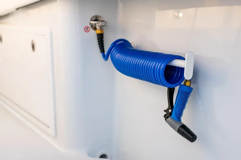 New Stock Yacht Photos Pics Blue coiled hose on 2026 Yellowfin 36 Offshore boat.