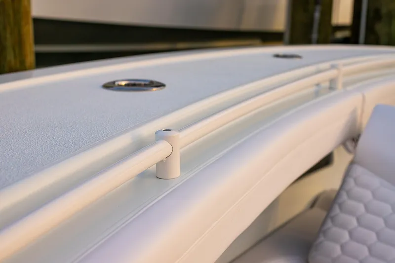 New Stock Yacht Photos Pics Close-up of 2026 Yellowfin 36 Offshore boat's sleek white railing and textured deck.