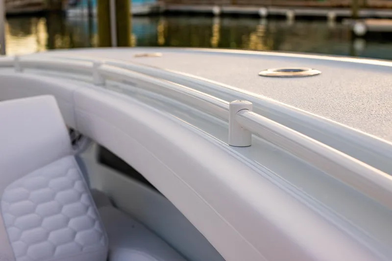 New Stock Yacht Photos Pics 2026 Yellowfin 36 Offshore boat interior with sleek white seating and railing.